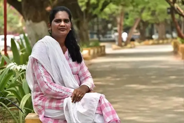 Taslima Nasreen sitting in a park