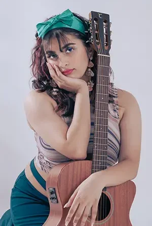 Trish-A with a guitar