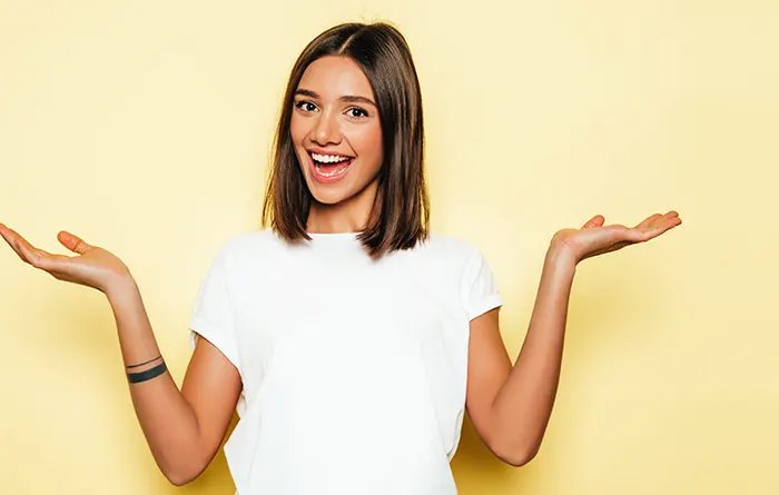 Young girl wearing white t-shirt smiling